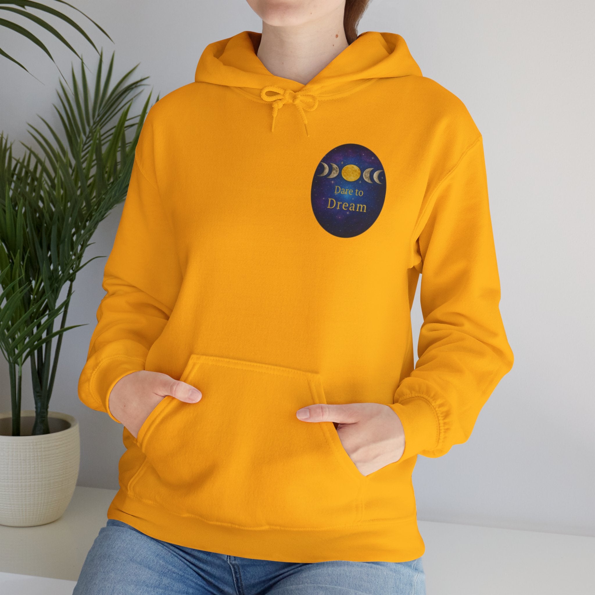 Dare to Dream Moon-Phase Hoodie | Back Glow Print + Front Badge | Heavy Blend™, Inspirational and Motivational Apparel, Gift for Dreamers, Creative Expression Wear